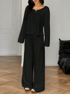 Women black long sleeve top and wide leg pants casual lounge set detail view showing relaxed fit.