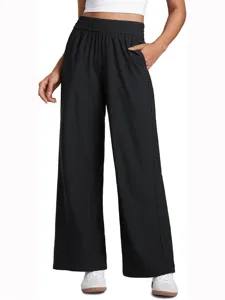 Detail shot of women's black high-waist wide-leg casual pants with elastic waistband.
