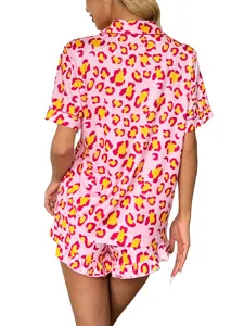 Detailed back view of pink leopard print short sleeve pajama top and ruffled shorts set.
