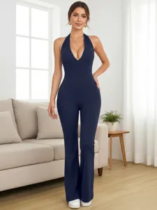 Dark blue halter deep V-neck fitted flare jumpsuit, detailed view showcasing slim fit.