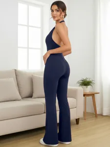 Dark blue halter backless tight jumpsuit detail view, showing sleek form-fitting design.