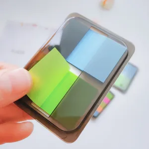Boxed transparent fluorescent sticky notes, colorful index tabs and page markers for office.