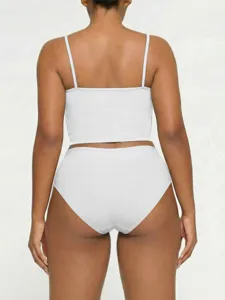 Detailed back view of a solid white camisole top and matching underwear set for women.