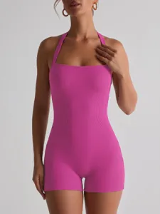 Detailed view of the ribbed pink halter romper showcasing the square neck and stretch fit.