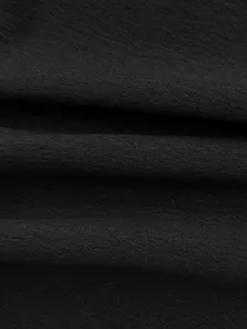 Black wide leg pants fabric detail texture close-up, elegant style trouser material.