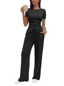 Detailed view of the stylish casual two-piece set with ruched short sleeve top and long pants.