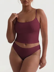 Detail view of plus-size burgundy camisole and panties set, soft smooth fabric summer wear.