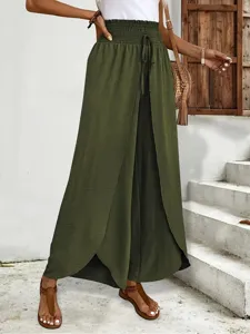 Detail view of stylish olive green split leg wide pants with high elastic waist and drawstring.