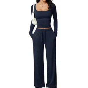 Detailed view of women's long sleeve crop top and wide leg lounge pants set in dark blue.