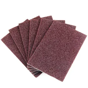 Brown abrasive sponge scouring pad for kitchen cleaning, rust removal and stubborn stain.