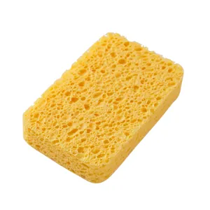 Yellow cellulose kitchen cleaning sponge, highly absorbent dishwashing scrub pad for household use.