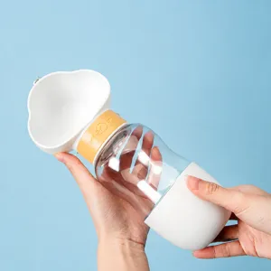 Portable dog water bottle for outdoor walking, leak-proof pet travel dispenser cup.