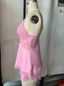 Pink lace camisole and shorts sleepwear set detail, comfortable loungewear apparel showcase.