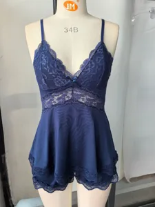 Dark blue lace camisole sleepwear set detail, delicate floral lace trim and soft fabric.
