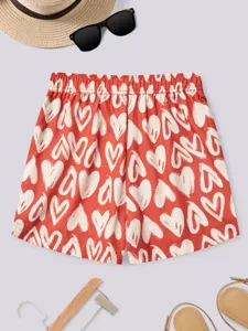 Women casual summer shorts with cute white heart print, high waist elastic design for comfort.