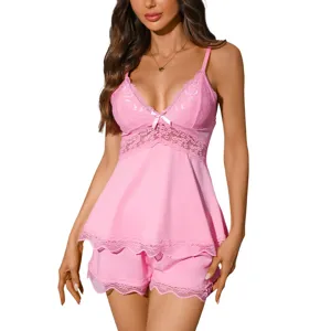 Comfortable pink lace camisole and shorts loungewear set, elegant satin sleepwear for women.