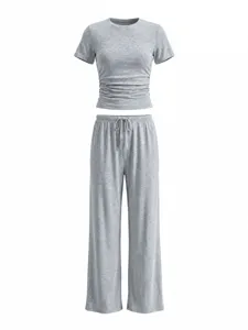 Grey short sleeve crop top and wide leg pants set detail view, soft fabric lounge wear.