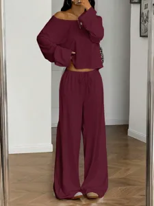 Detailed view of the stylish off-the-shoulder long sleeve top and wide leg pants lounge set.