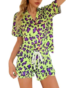 Neon green purple leopard print pajama set detail, featuring button-down shirt and shorts.
