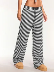 Detailed view of women's black and white striped wide leg casual pants with drawstring waist.