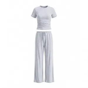 Grey two-piece casual sportswear set for women, featuring ruched crop top and wide-leg pants.