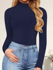 Close-up detail of women's slim-fit mock turtleneck long-sleeve solid top in navy blue.