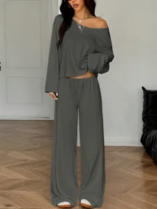 Details of the dark grey off-the-shoulder long sleeve top and wide leg pants loungewear set.