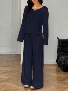 Close-up detail of the dark blue casual off-shoulder long sleeve wide leg pants set.