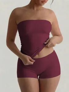 Detailed view of the women's strapless tube top and shorts set in burgundy slim fit.