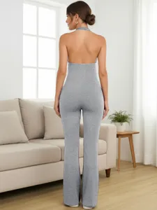 Detailed back view of a grey halter neck backless tight jumpsuit showcasing fitted design.