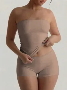 Detail view of women's seamless nude tube top and shorts set, slim fit summer casual lounge outfit.