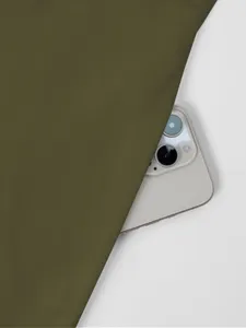 Solid color fabric detail close-up showcasing smooth texture and elegant olive green tone.