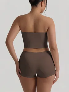 Back view detail of women's brown strapless tube top and matching shorts set, slim fit style.
