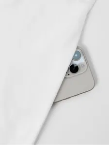 White solid color sleeveless dress fabric close-up detail showcasing smooth texture