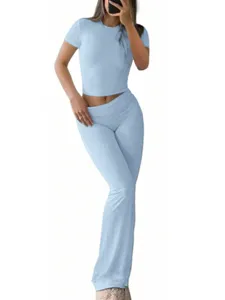 Light blue Y2K two-piece casual set featuring a slim fit crop top and high waist flare pants.