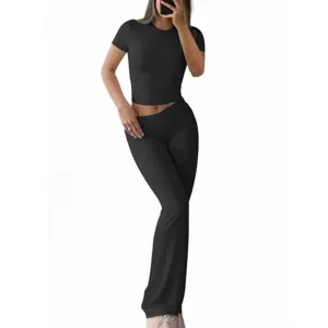 Stylish women summer casual solid color slim short sleeve crop top and flared pants set