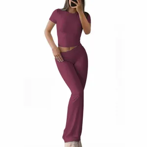 Women solid color short sleeve crop top and flare pants two piece set casual outfit main view