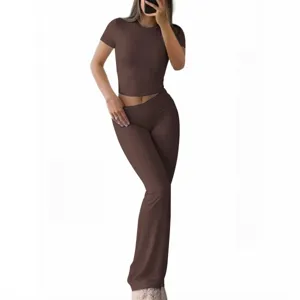 Solid color slim short sleeve crop top and flare pants set for women, casual summer outfit.
