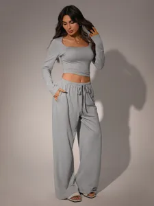 Women grey casual two-piece set square neck long sleeve crop top and loose wide leg trousers.