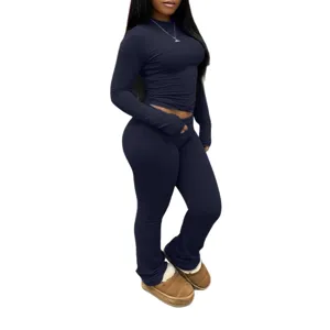 Dark blue long sleeve crop top and flare pants set, stylish and comfortable casual wear.