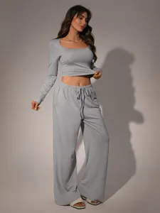 Grey long sleeve crop top and wide leg pants loungewear detail showing fit and fabric texture.