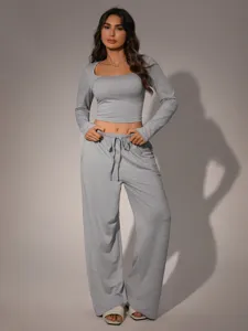 Women casual grey ribbed long sleeve crop top and wide leg pants lounge set detail shot.