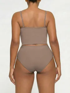 Back detail view of women's solid color camisole top and matching underwear briefs set.