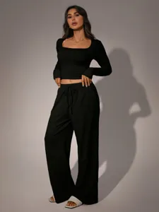 Women's black casual long sleeve crop top and wide leg pants loungewear set autumn style.