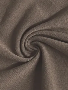 Detailed shot of soft brown fabric material with fine texture, premium clothing material view