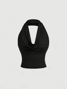 Detail view of a black cowl neck halter top, showcasing the elegant draped neckline and soft fabric texture.