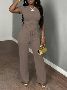Close-up detail of the women's two-piece short sleeve top and casual sweatpants set.