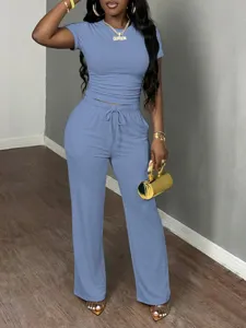 Detail view of women two piece set short sleeve top and casual lounge pants for daily wear.