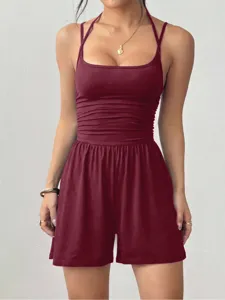 Close-up detail of women's burgundy halter neck camisole romper with slim fit shorts.