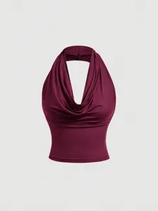 Detailed view of the elegant burgundy cowl neck halter vest, highlighting the stylish neckline.